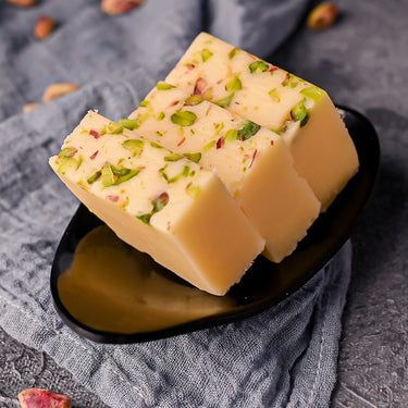 https://cdn.shopify.com/s/files/1/1857/6931/files/VellankiFoods-ButterBurfi.jpg?v=1716901722